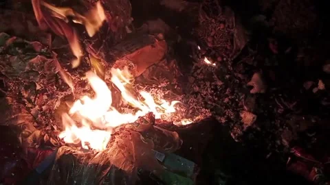 Fire burning rubbish in the dark 8 Stock Footage 327386843