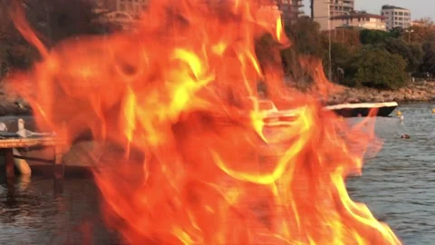 Fire burning by the sea Video stock 144338079