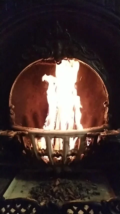 Fire burning in Slow motion in black forged vintage fireplace Stock Footage 140962557