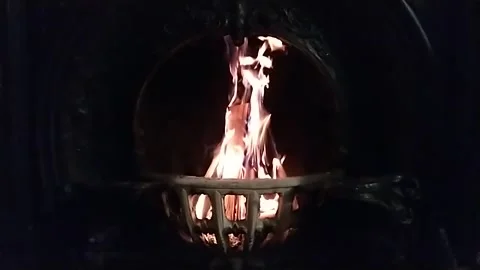 Fire burning in Slow motion in black forged vintage fireplace Stock Footage 140995881
