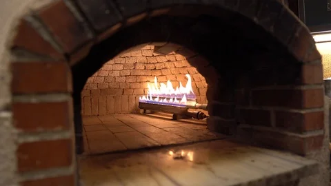 Fire burning in stone oven Vídeos de archivo 103516510