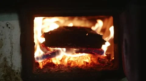 Fire burning under pot full of meat in slow motion Stock Footage 44290584