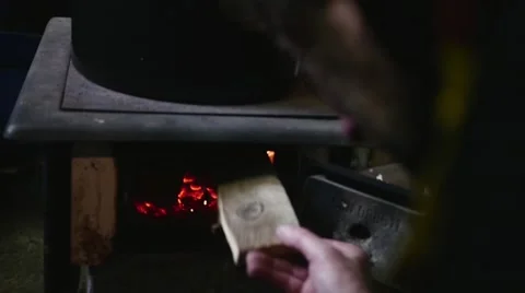 Fire burning under pot full of meat in slow motion Stock Footage 44294998