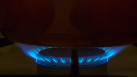 Fire burning under saucepan with boiling eggs Stock Footage 97739414