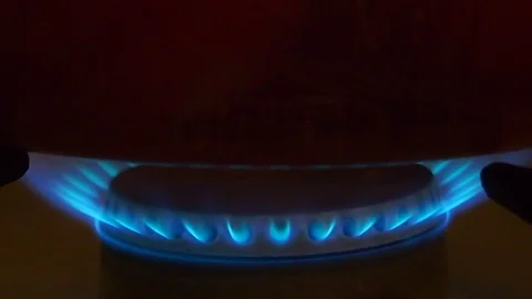 Fire burning under saucepan with boiling eggs Stock Footage 97739421