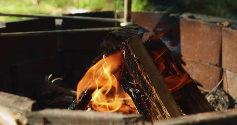 Fire burning wood in firepit in slow motion Stock Footage 98271636