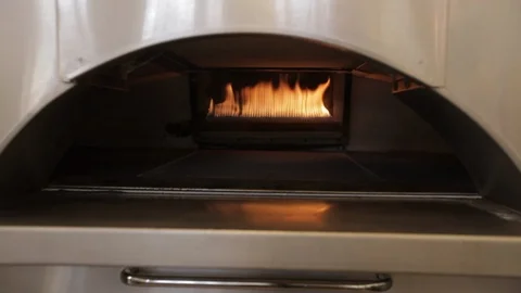 Fire burns in the back of an oven Stock Footage 90886205