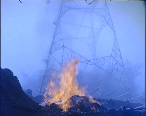 Fire Burns at Base of TV Transmitter Tower (1963) Video stock 99862808