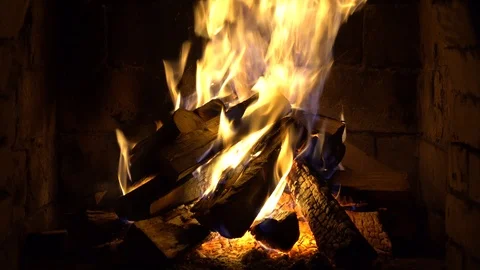 A fire burns in a brick fireplace, keep warm Stock Footage 101851066