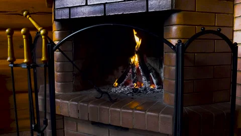 Fire burns in a brick fireplace. Video 2 Stock Footage 131455973