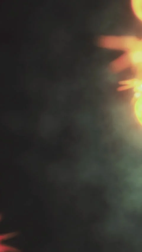 Fire burns brightly in dark setting at night during an outdoor gathering Stock Footage 334885396