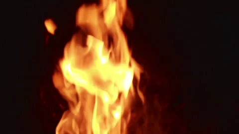 Fire burns brightly in four different frames showing flames with varying shapes Stock Footage 344318079