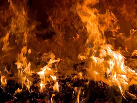 Fire Burns Brightly in the Oven Creating Heat and Light in the Kitchen 스톡 사진