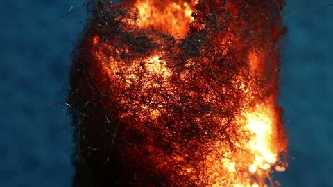 Fire Burns Downwards Through Pillar of Steel Wool MAC Stock Footage 74546018