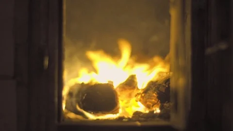 The fire burns in the fireplace. 4K Stock Footage 74743087