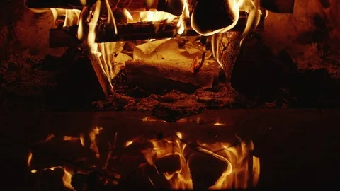 Fire burns in the fireplace with beautiful reflections Stock Footage 80048483