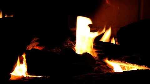 A fire burns in a fireplace. Close up view of fire flames Stock Footage 101603611