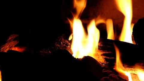 A fire burns in a fireplace. Close up view of fire flames Stock Footage 101603708