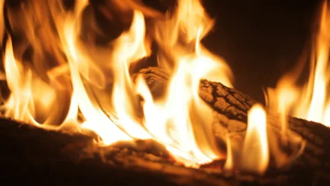 Fire burns in the fireplace. Evening mood. Holiday concept. Background. Stock Footage 106846381