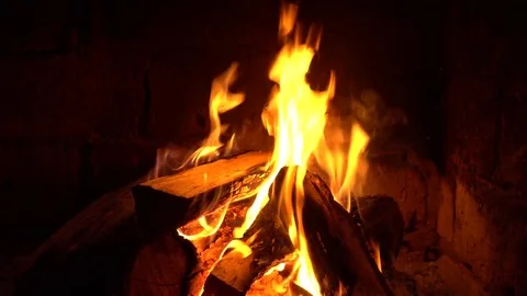 A fire burns in a fireplace, Fire to keep warm Stock Footage 81756635