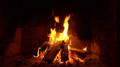 A fire burns in a fireplace, Fire to keep warm Stock Footage 81831851