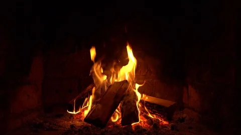 A fire burns in a fireplace, Fire to keep warm Stock Footage 81831917