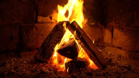 A fire burns in a fireplace, Fire to keep warm Stock Footage 82433445