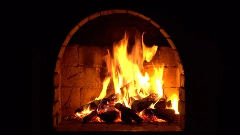 A fire burns in a fireplace, Fire to keep warm Stock Footage 83464052