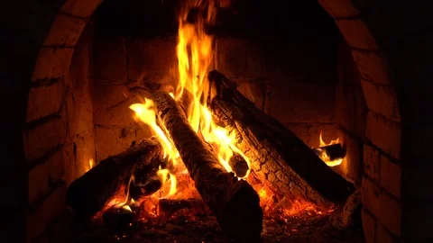 A fire burns in a fireplace, Fire to keep warm Stock Footage 86177717