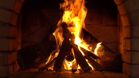 A fire burns in a fireplace, Fire to keep warm Stock Footage 86587921