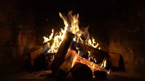 A fire burns in a fireplace, Fire to keep warm Stock Footage 147391279