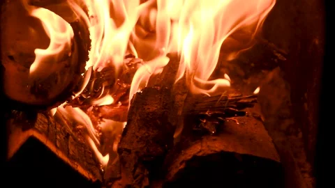 A fire burns in a fireplace. Fire to keep warm. Видео 165561731
