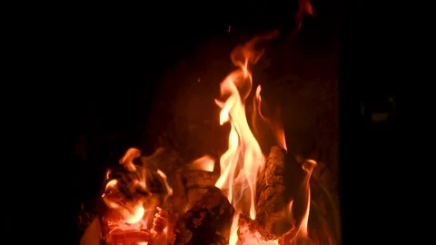 A fire burns in a fireplace. Fire to keep warm. Stock Footage 166411232