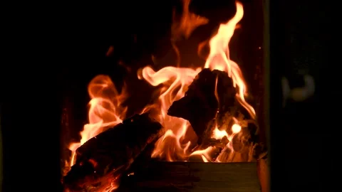 A fire burns in a fireplace. Fire to keep warm. Видео 166411278