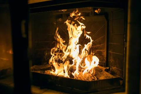 A fire burns in a fireplace, Fire to keep warm. Фото