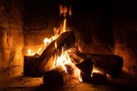A fire burns in a fireplace, Fire to keep warm Stock-Fotos