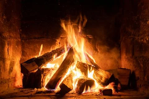 A fire burns in a fireplace, Fire to keep warm Foto stock