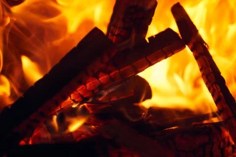 A fire burns in a fireplace, Fire to keep warm. Logs burning in a fireplace Stock Photos