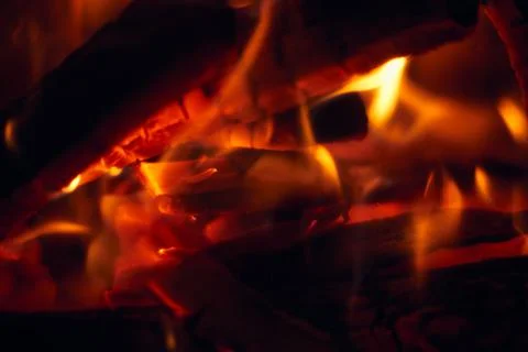 A fire burns in a fireplace, Fire to keep warm. Logs burning in a fireplace Stock Photos