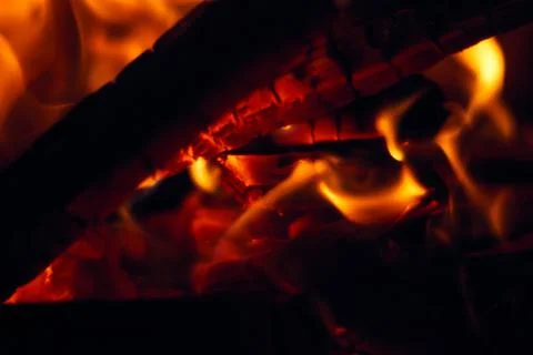 A fire burns in a fireplace, Fire to keep warm. Logs burning in a fireplace Stock Photos