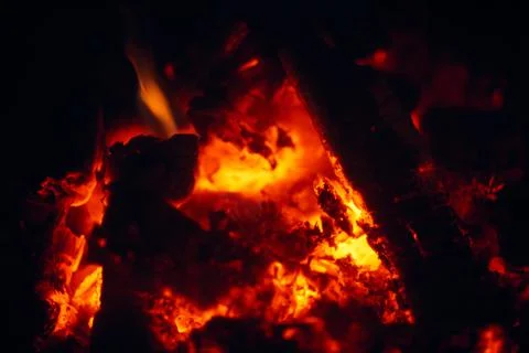 A fire burns in a fireplace, Fire to keep warm. Logs burning in a fireplace Stock Photos