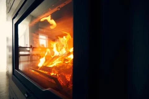 A fire burns in a fireplace, Fire to keep warm. Logs burning in a fireplace Foto stock