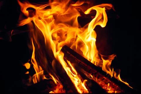 A fire burns in a fireplace, Fire to keep warm. Logs burning in a fireplace Foto stock