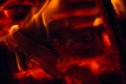 A fire burns in a fireplace, Fire to keep warm. Logs burning in a fireplace Stock Photos