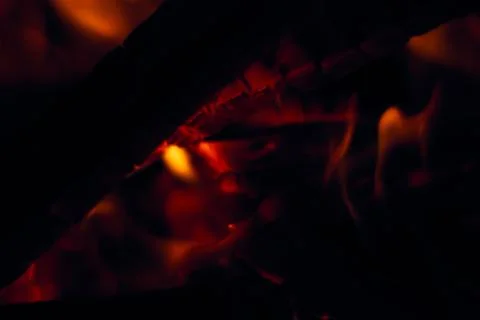 A fire burns in a fireplace, Fire to keep warm. Logs burning in a fireplace Stock Photos