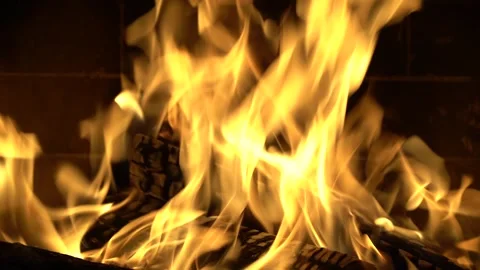A fire burns in a fireplace, winter vacation in country house Stock Footage 294090941