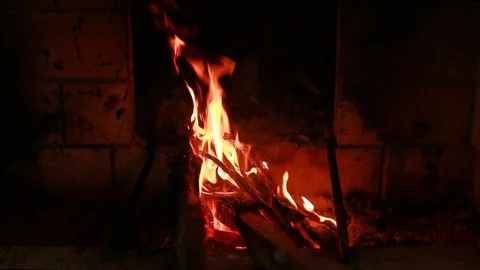 The fire burns in the forge. Stirring the coals Stock Footage 97858862