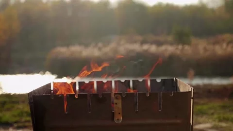 Fire burns in the grill. Concept of cooking in the grill on the nature Stock Footage 130238361