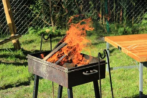 Fire burns in the grill 스톡 사진