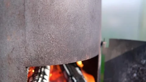 The fire burns in an open old wood-burning stove. Stock Footage 249726436